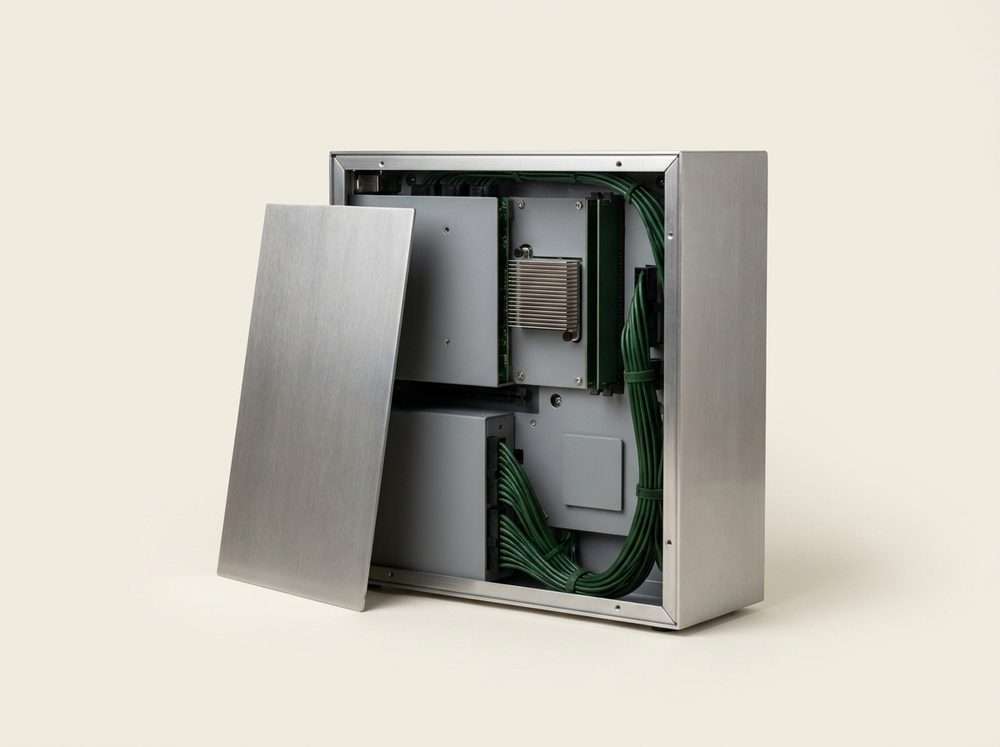 A steel agent appliance with its side panel lifted off, showing the boards and cabling inside.